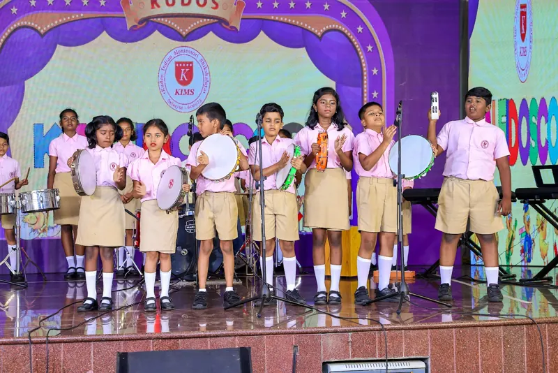 Children in the school band with tambourines and drums