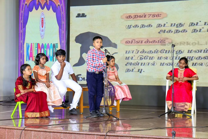 A child recites a Thirukkural couplet in Tamil