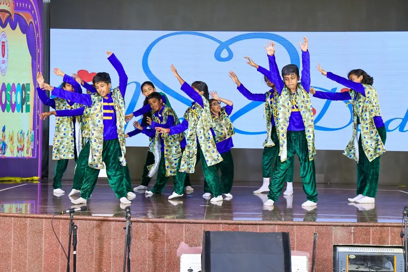 A dance in green and blue costumes