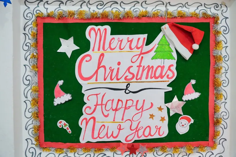 A Merry Christmas and Happy New Year board made by the school