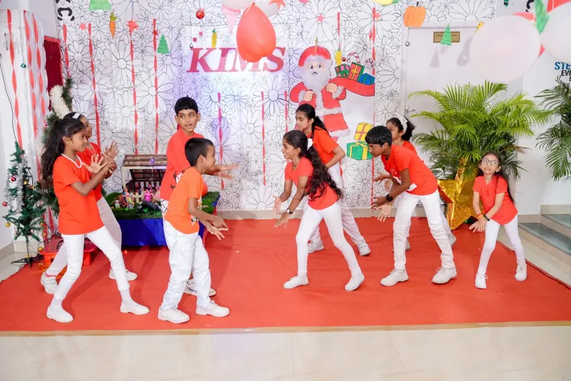 Children dance together in a circle