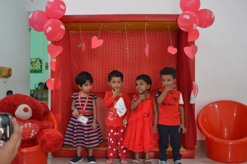 Children in red at the red photo corner