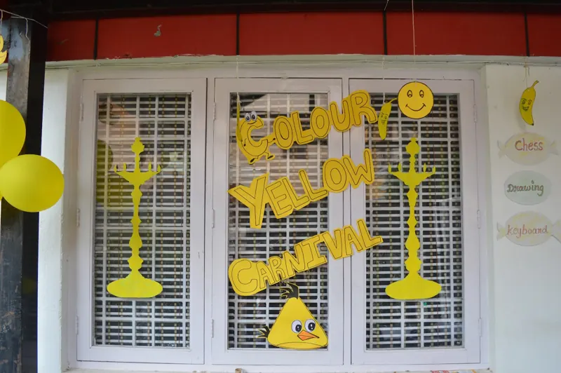 A Colour Yellow Day sign on the classroom door