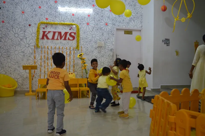 Children play in the yellow room