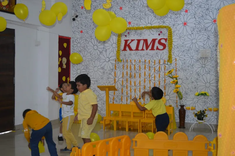 Children play in the yellow room