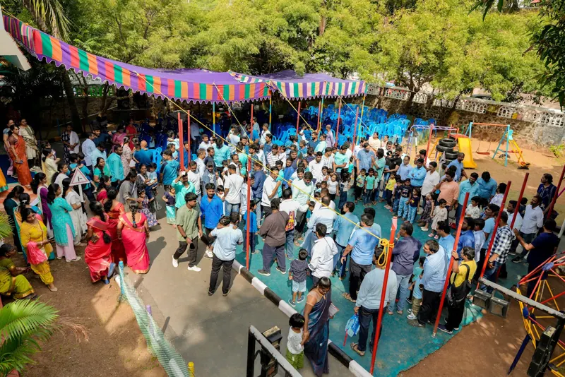 A crowd of fathers and children in the playground
