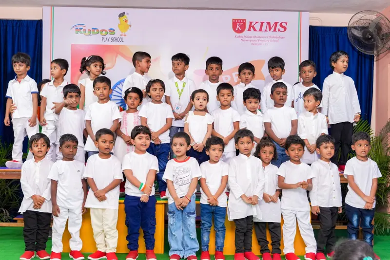 Teachers and children in tricolour