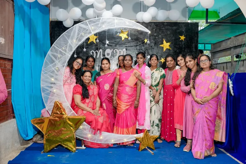 Teachers at the moon-and-stars photo corner