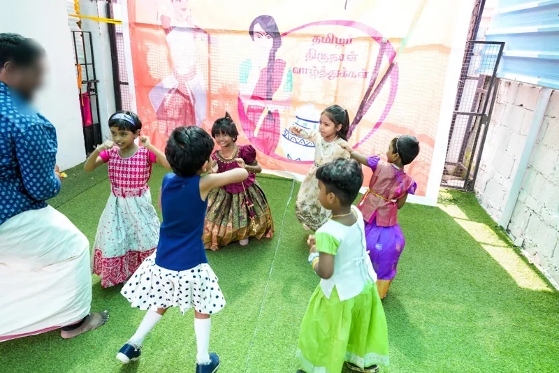 Children dance with a teacher