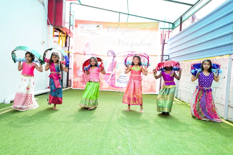 Girls dance in traditional dress