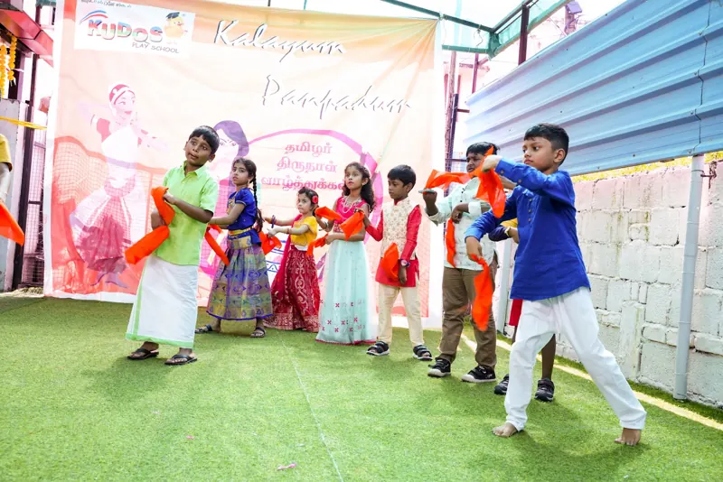 Boys and girls in traditional clothes perform a dance