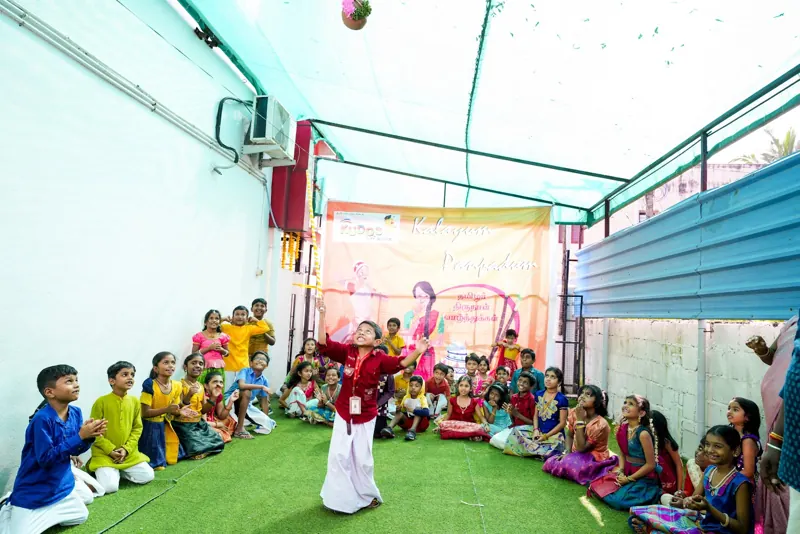 Children watch a dance in the hall