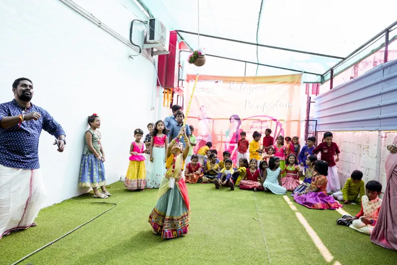 A girl dances as her class watches