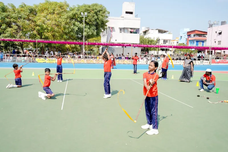 Children in a relay game on the field
