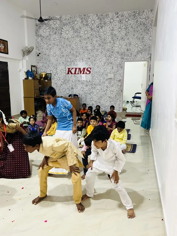 Boys in veshti dance in the hall