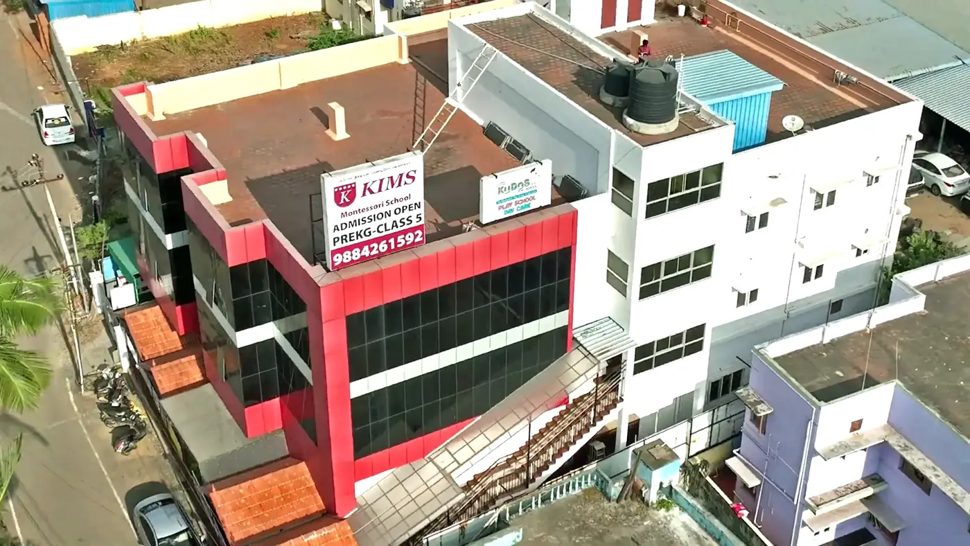 The red and black KIMS building in Selaiyur, seen from a drone
